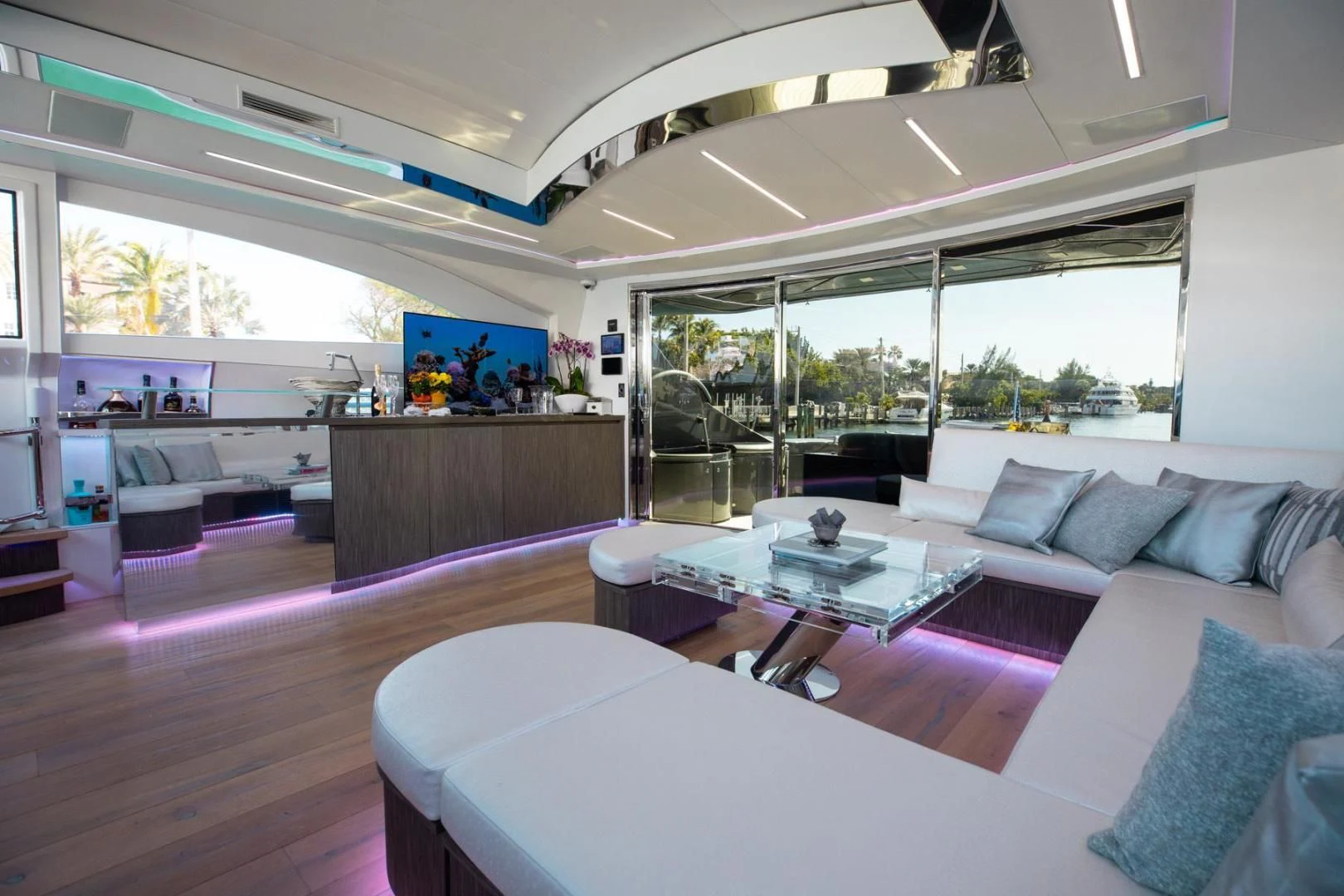 a living room with a large window aboard AMORA Yacht for Sale