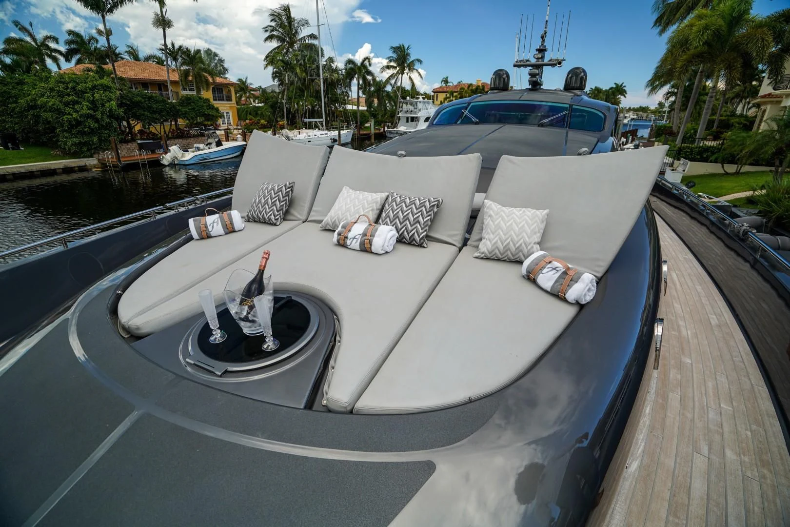 a white lounge chair on a deck aboard AMORA Yacht for Sale