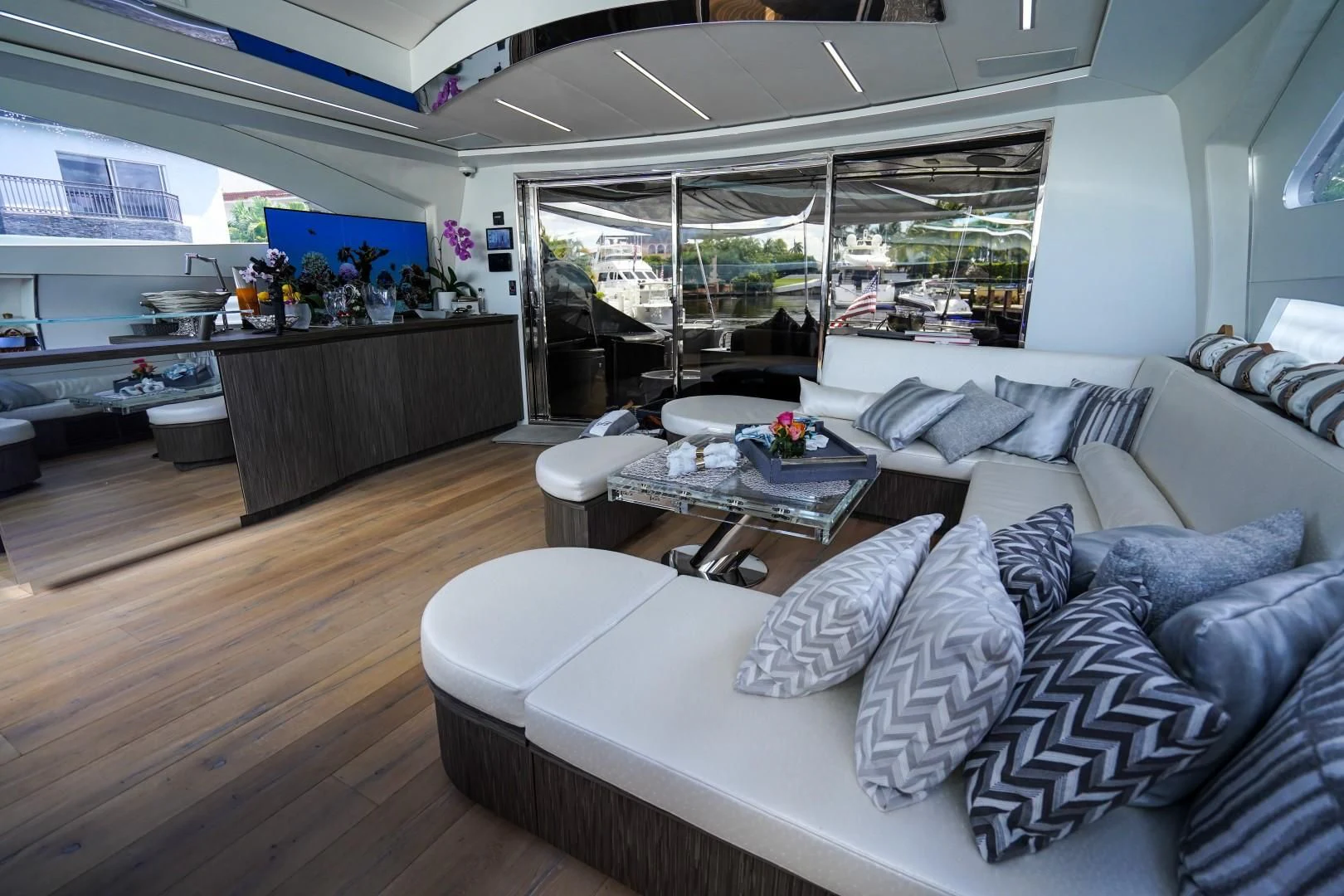 a living room with a large window aboard AMORA Yacht for Sale