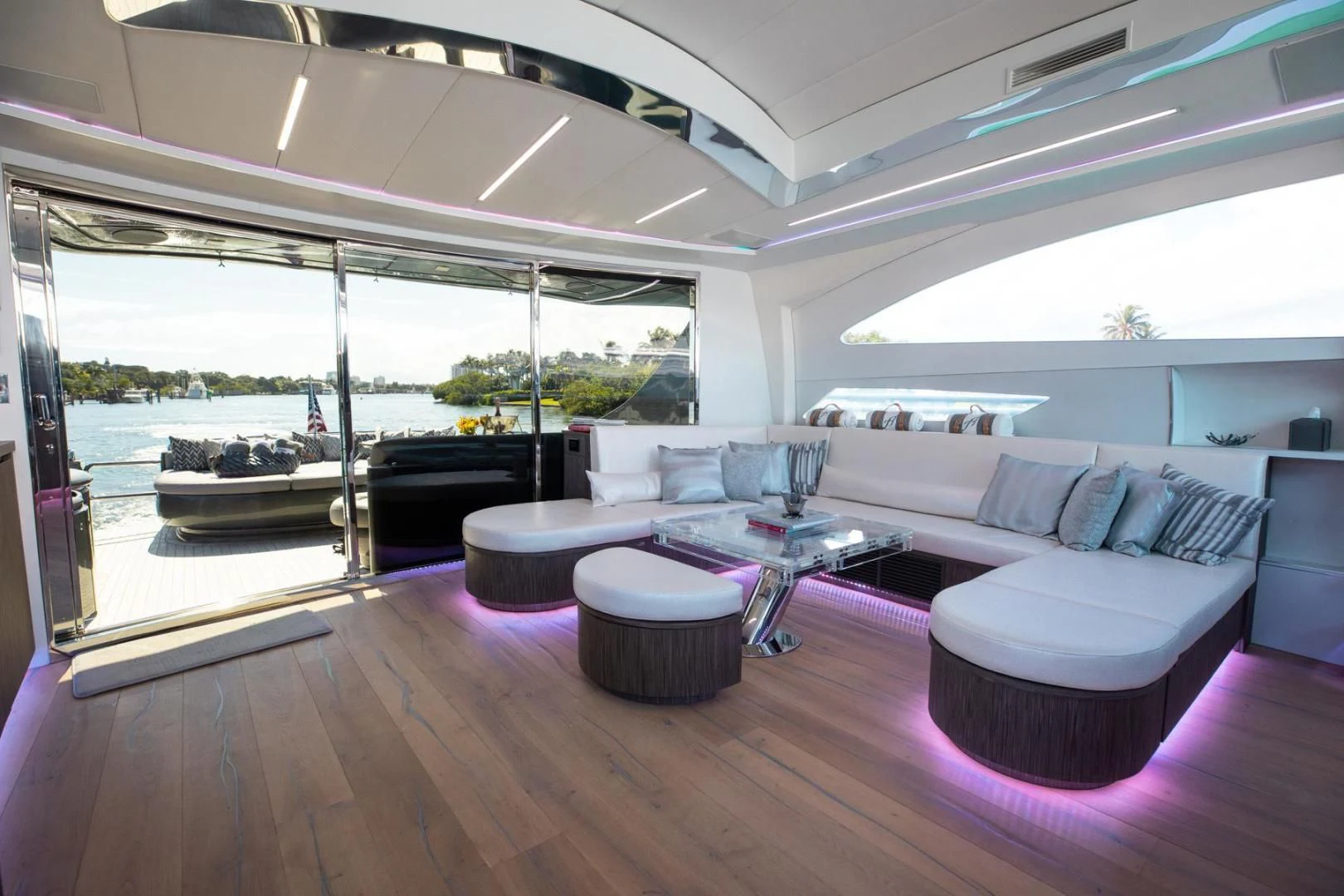a living room with a large window aboard AMORA Yacht for Sale