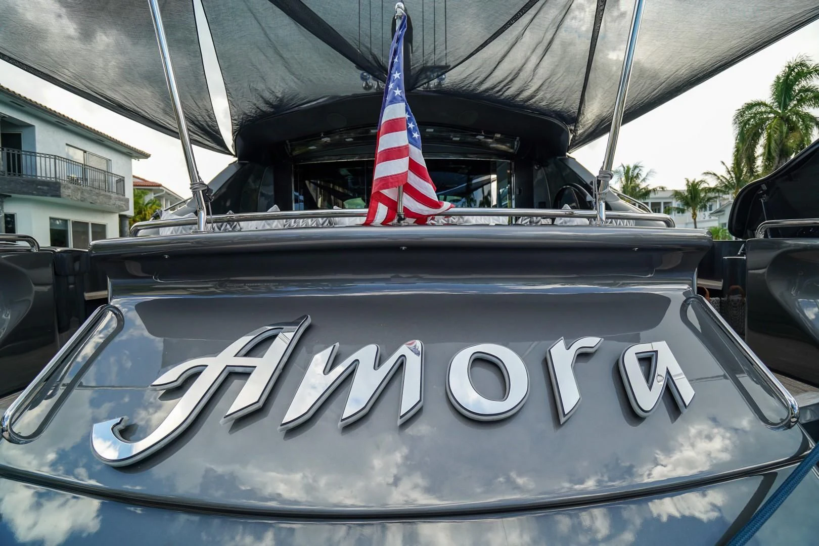 the front of a car with a flag on the hood aboard AMORA Yacht for Sale