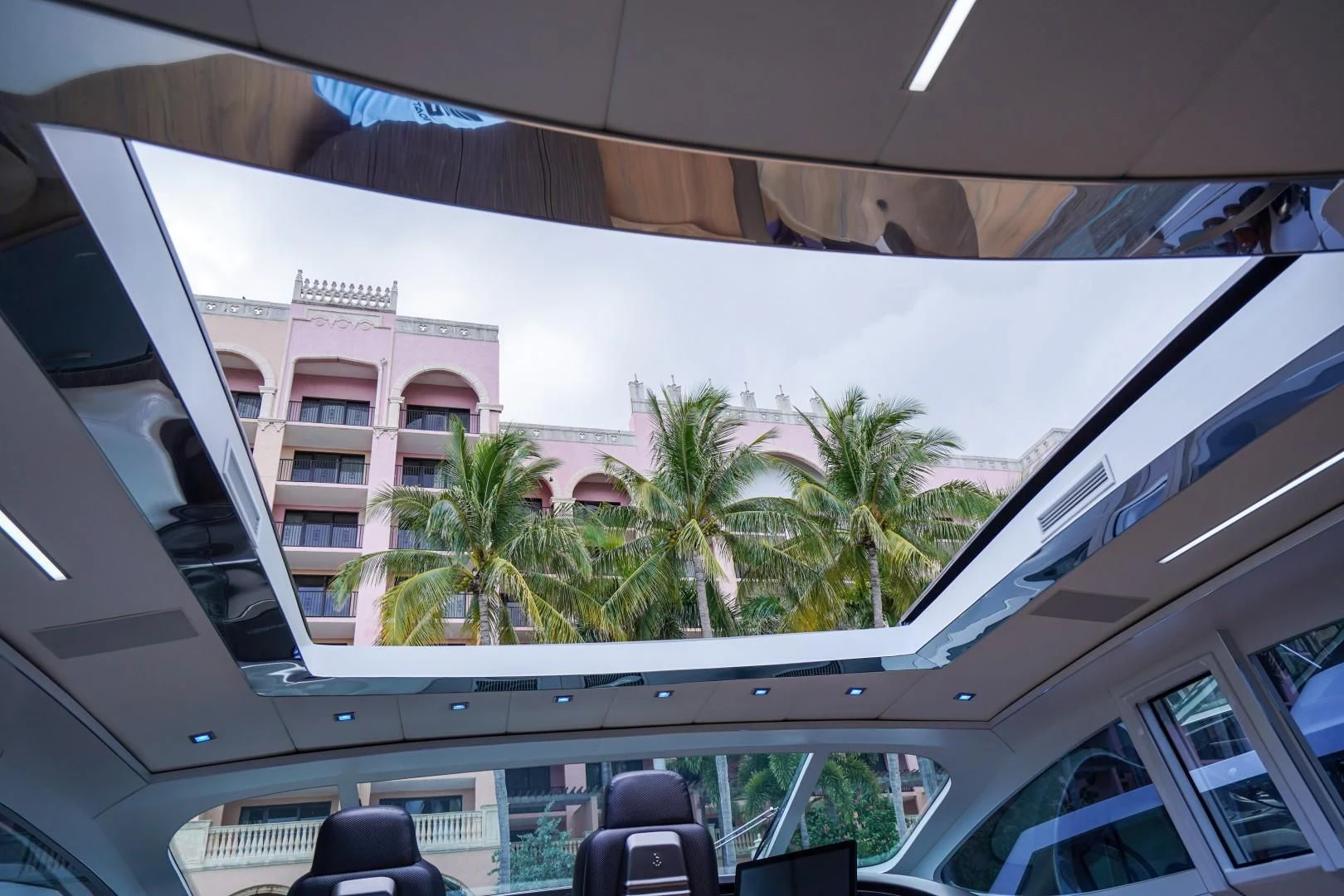 a building with palm trees aboard AMORA Yacht for Sale