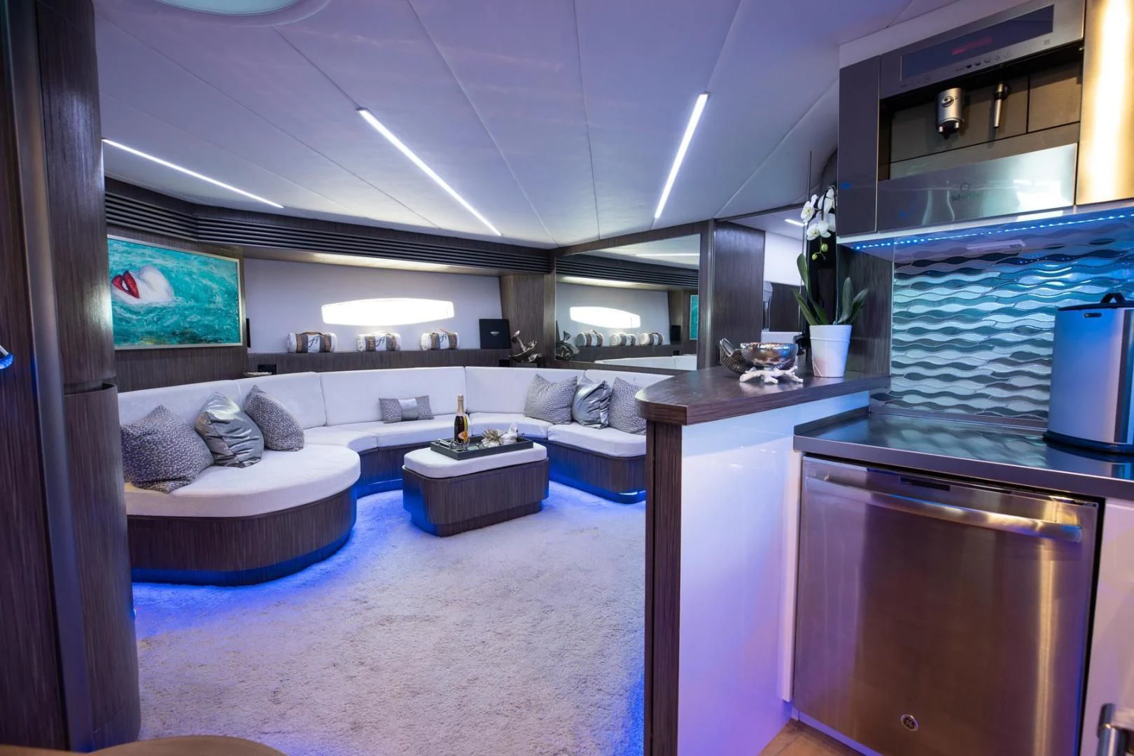 a room with a bed and a table aboard AMORA Yacht for Sale