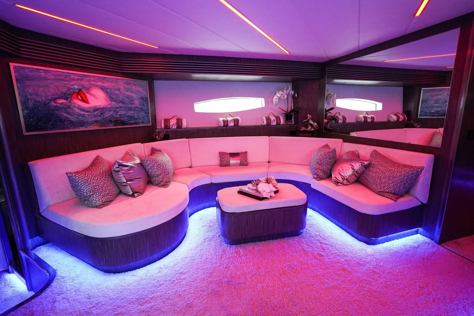 a room with a couch and a table aboard AMORA Yacht for Sale