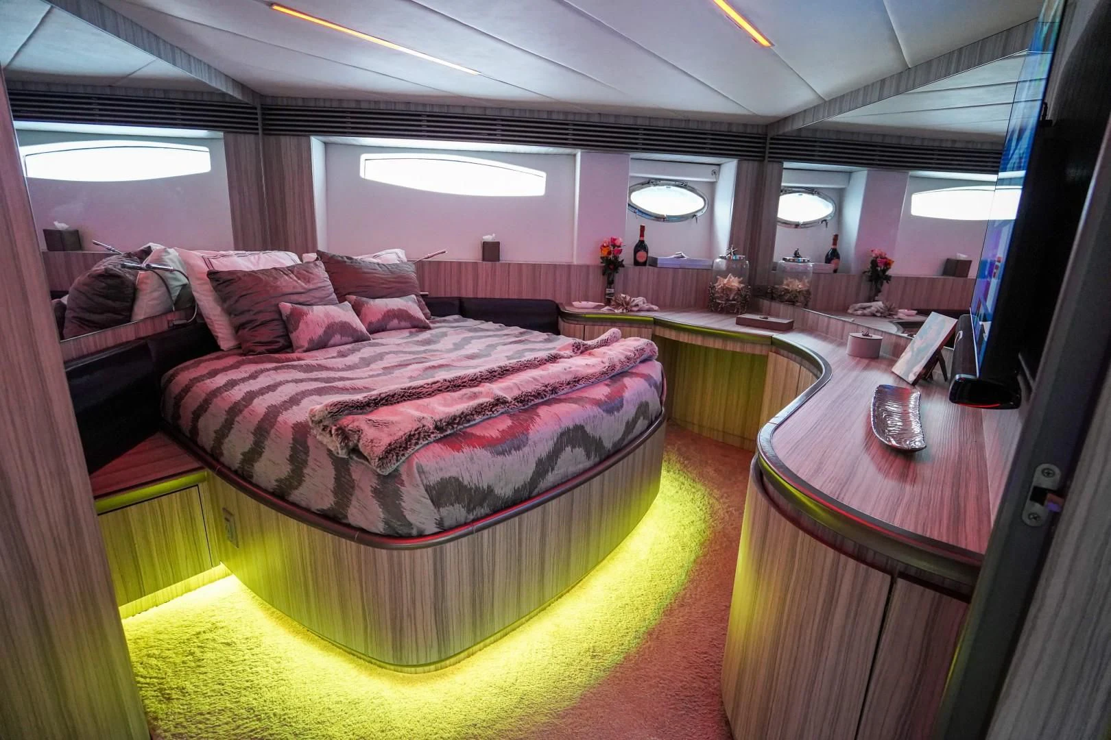 a room with a bed and a table aboard AMORA Yacht for Sale
