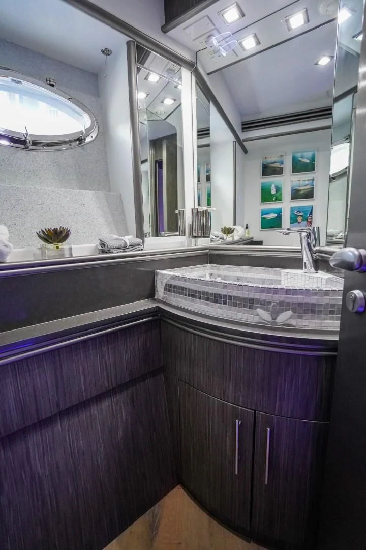 a kitchen with a marble counter top aboard AMORA Yacht for Sale