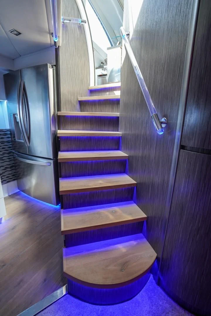 a set of stairs in a room aboard AMORA Yacht for Sale