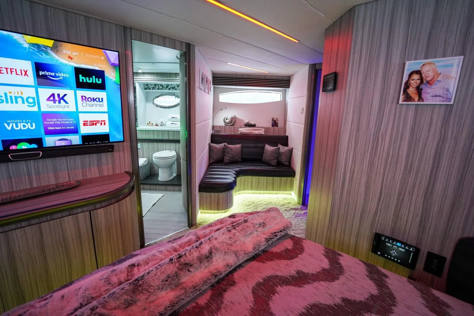 a room with a bed and a tv aboard AMORA Yacht for Sale