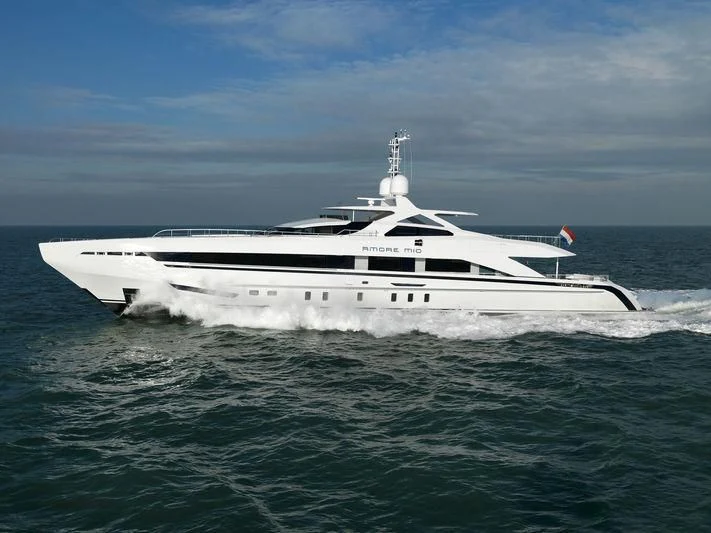 a white yacht in the water aboard AMORE MIO Yacht for Sale