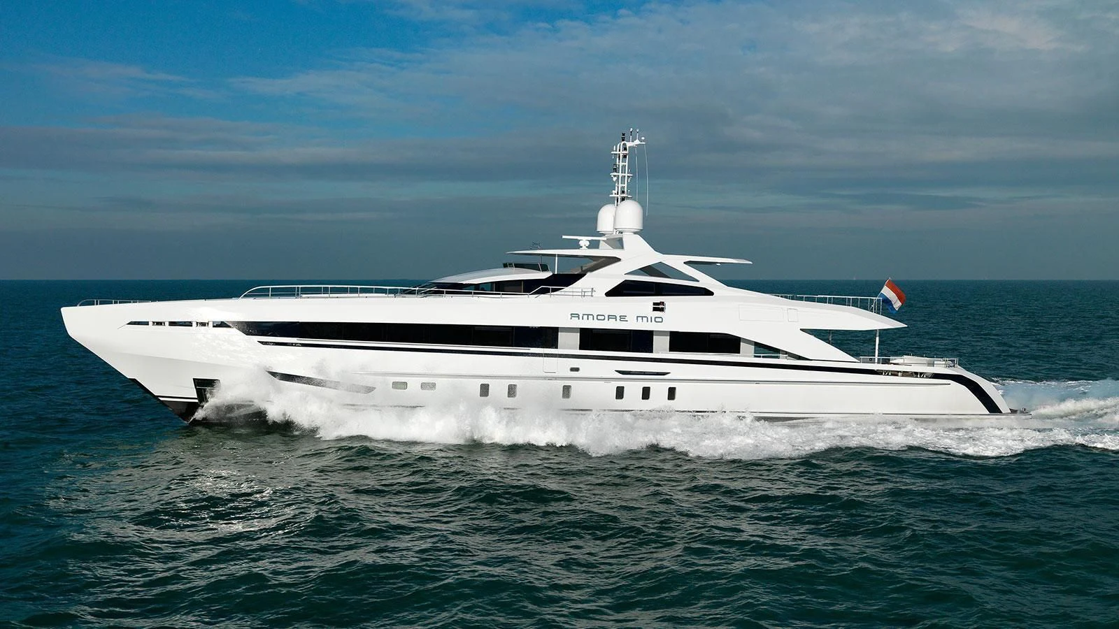 a white yacht in the water aboard AMORE MIO Yacht for Sale
