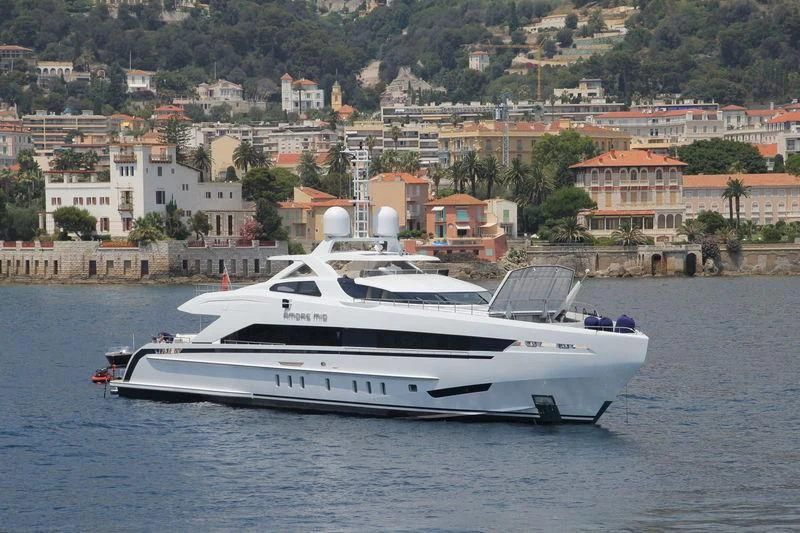 a white yacht on the water aboard AMORE MIO Yacht for Sale