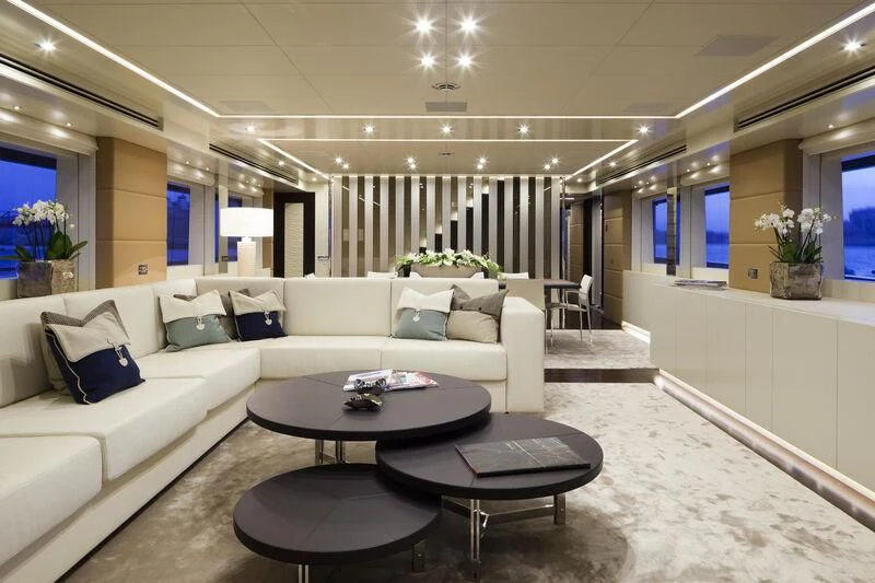 a living room with a white couch aboard AMORE MIO Yacht for Sale