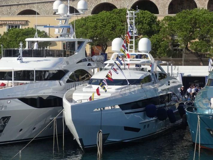 several boats docked at a pier aboard AMORE MIO Yacht for Sale