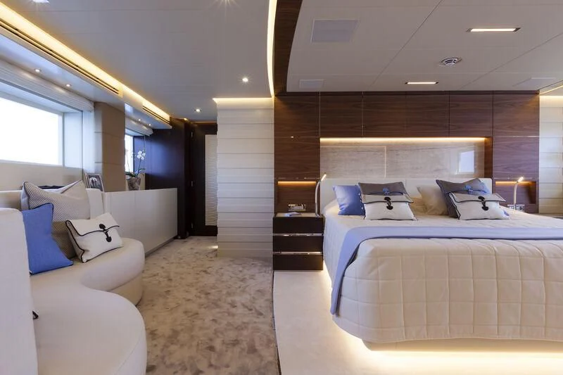 a room with a bed and a couch aboard AMORE MIO Yacht for Sale