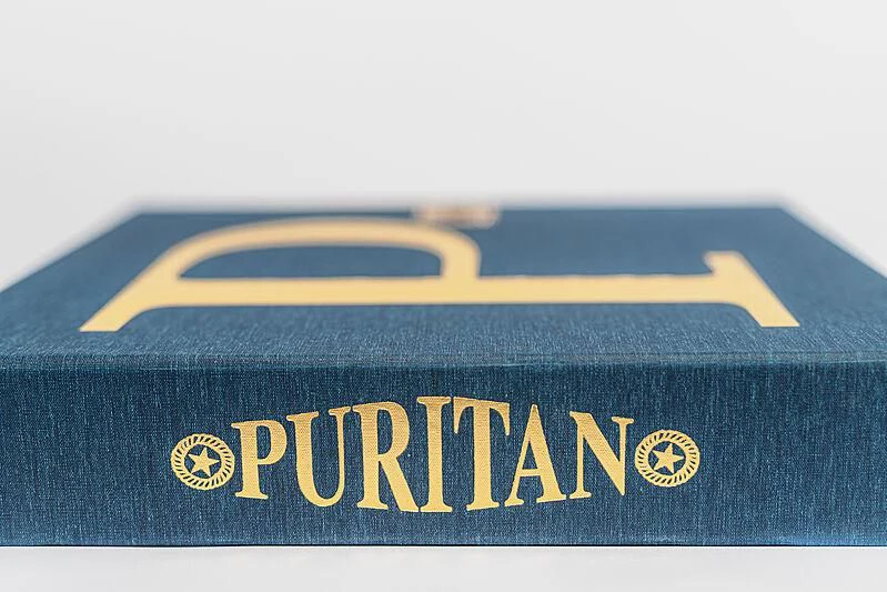 a blue and yellow license plate aboard PURITAN Yacht for Sale