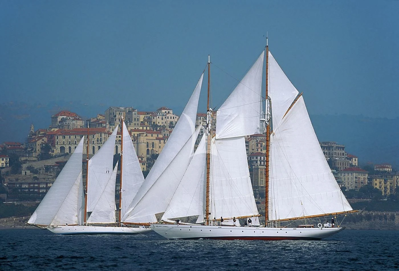 a large white sailboat on the water aboard PURITAN Yacht for Sale