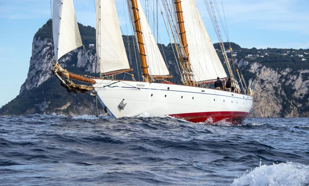 a sailboat on the water aboard PURITAN Yacht for Sale
