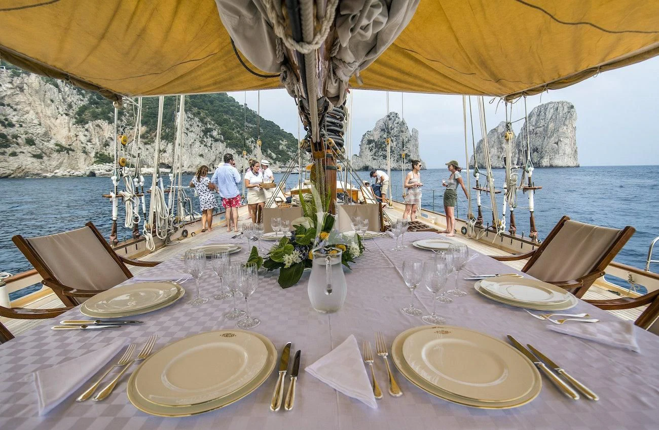 a table set with place settings aboard PURITAN Yacht for Sale