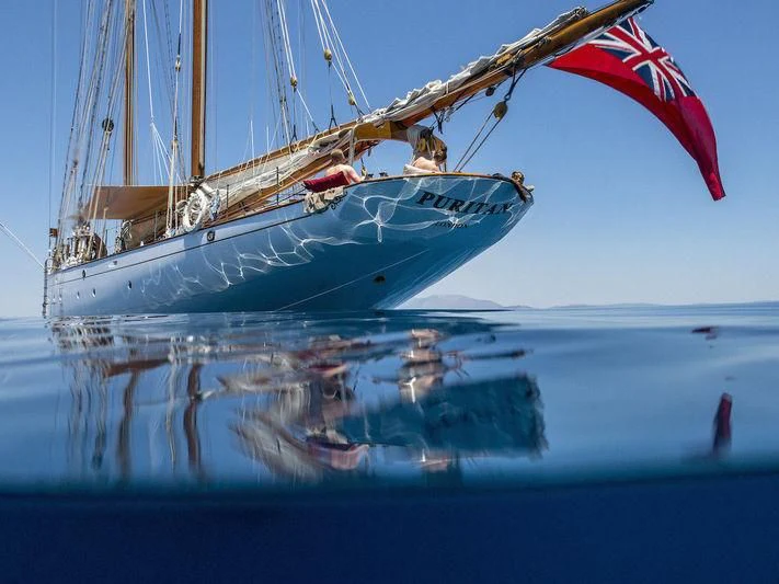 a sailboat on the water aboard PURITAN Yacht for Sale