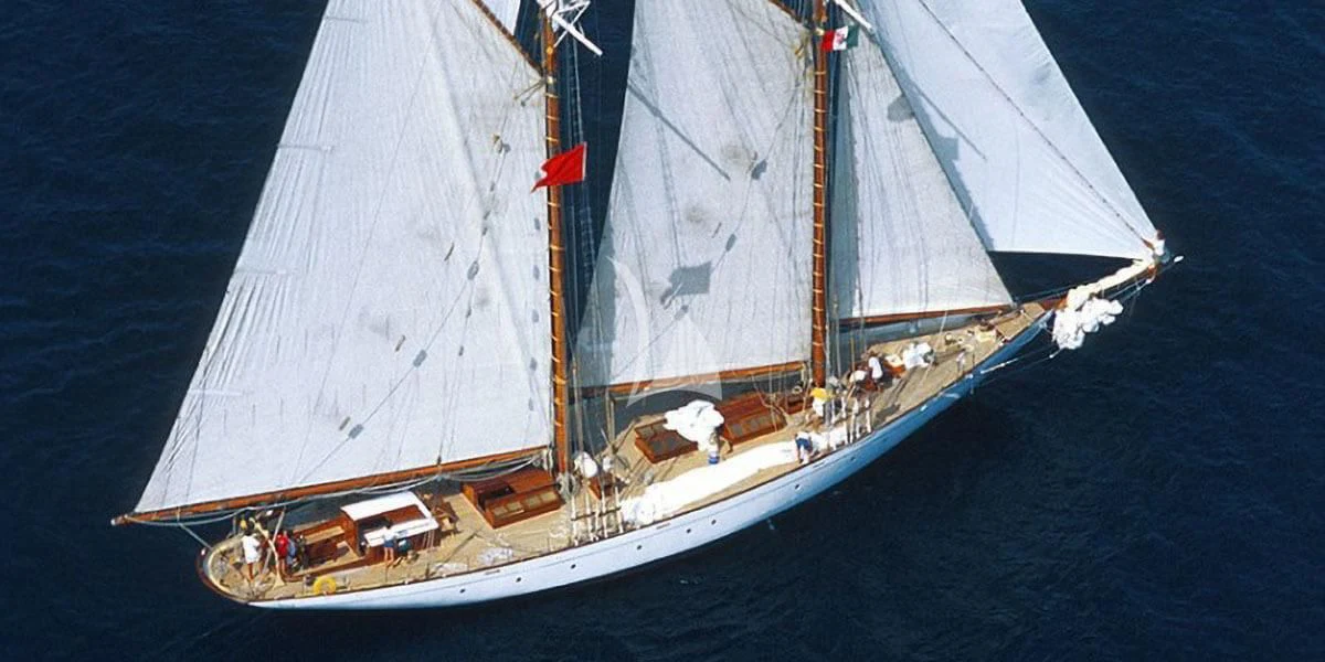 a large ship in the water aboard PURITAN Yacht for Sale