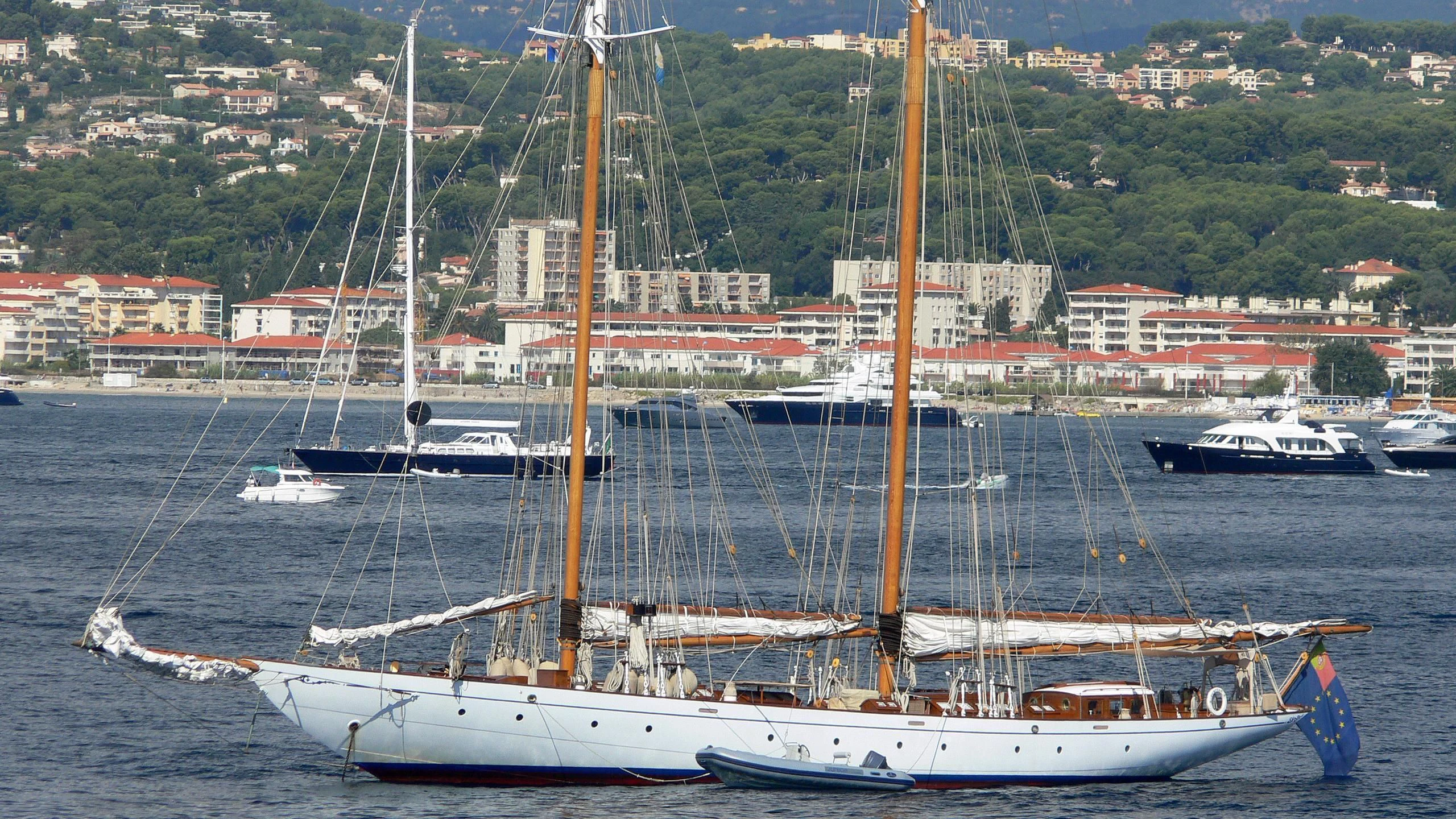 a large ship in the water aboard PURITAN Yacht for Sale