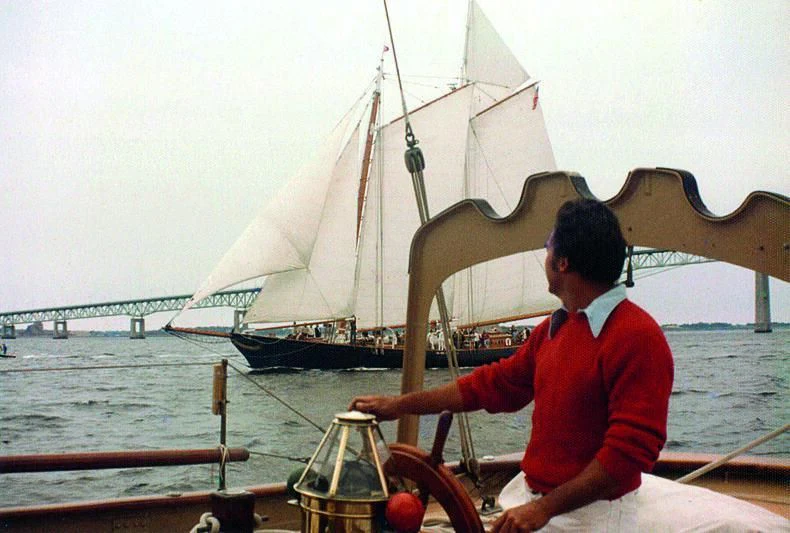 a man sitting on a boat aboard PURITAN Yacht for Sale