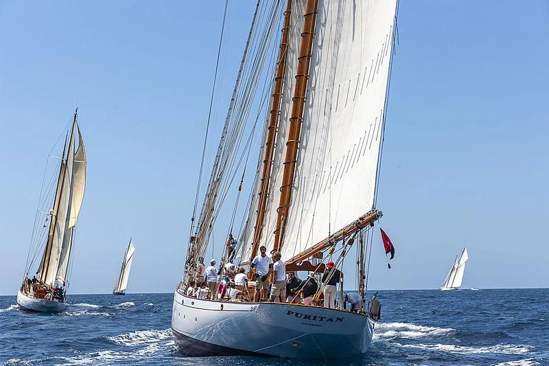 a group of people sailing on a boat aboard PURITAN Yacht for Sale