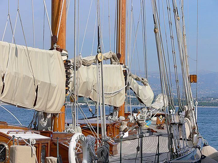 a boat with sails aboard PURITAN Yacht for Sale