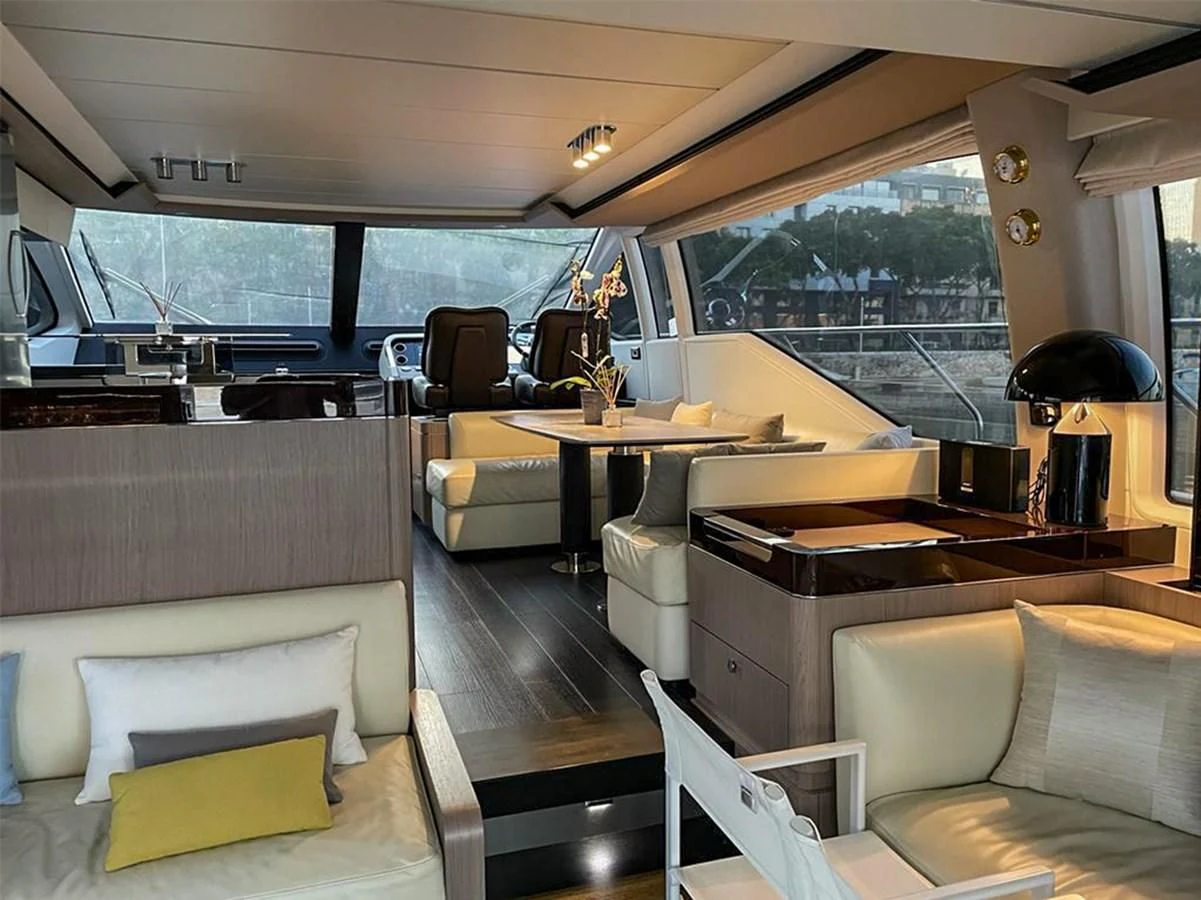a room with a table and chairs aboard OOSA Yacht for Sale