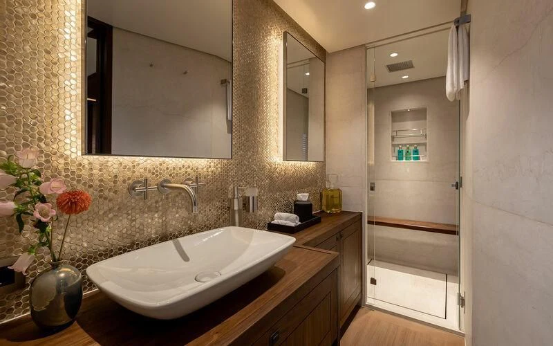 a bathroom with a large mirror aboard JOSEPHINE I Yacht for Sale