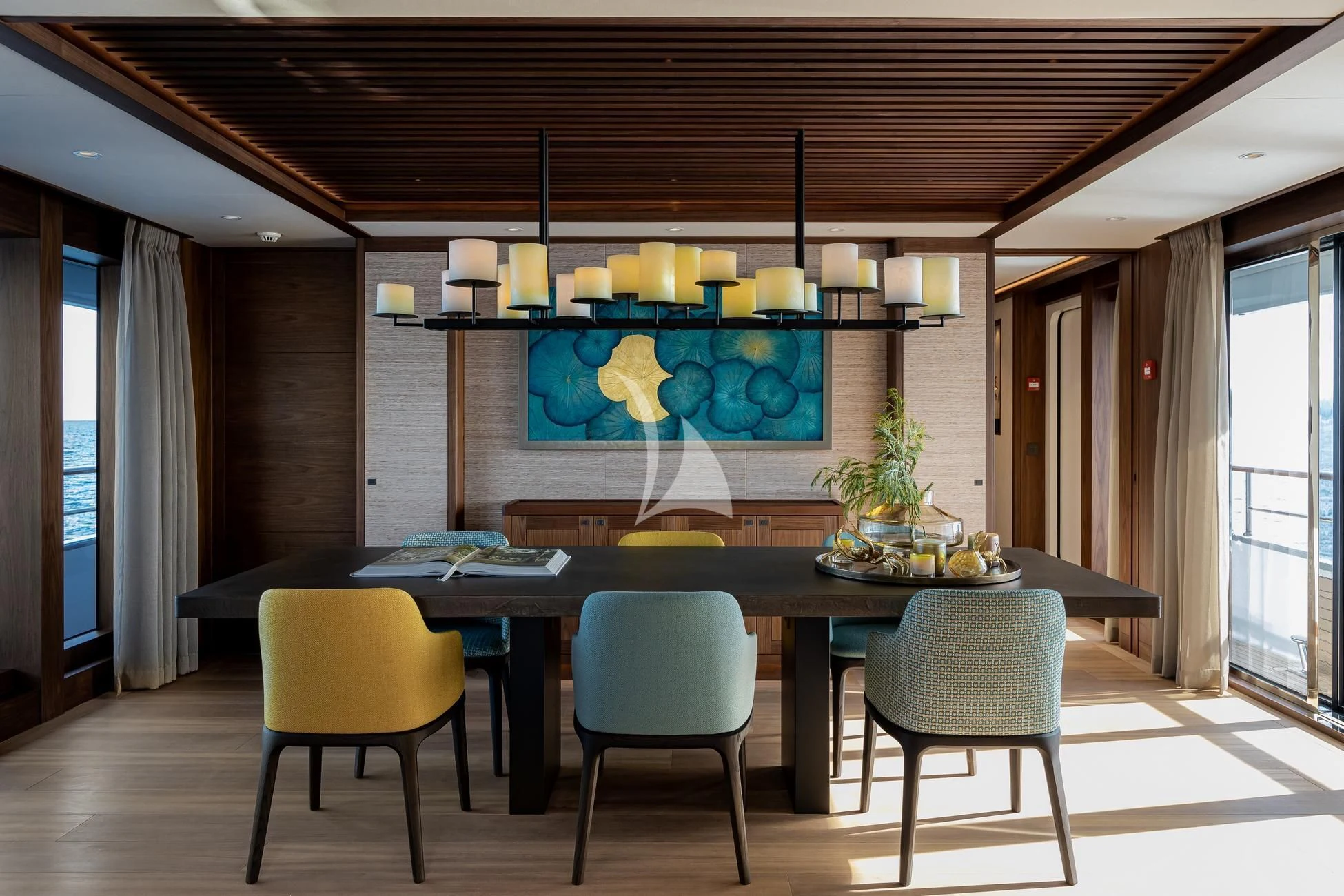 a large kitchen with a table and chairs aboard JOSEPHINE I Yacht for Sale