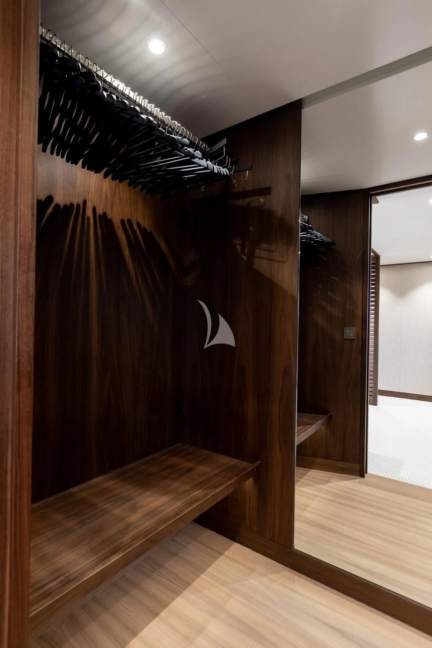 a room with a wood floor and a wood wall with a black and white wall and wood floor aboard JOSEPHINE I Yacht for Sale