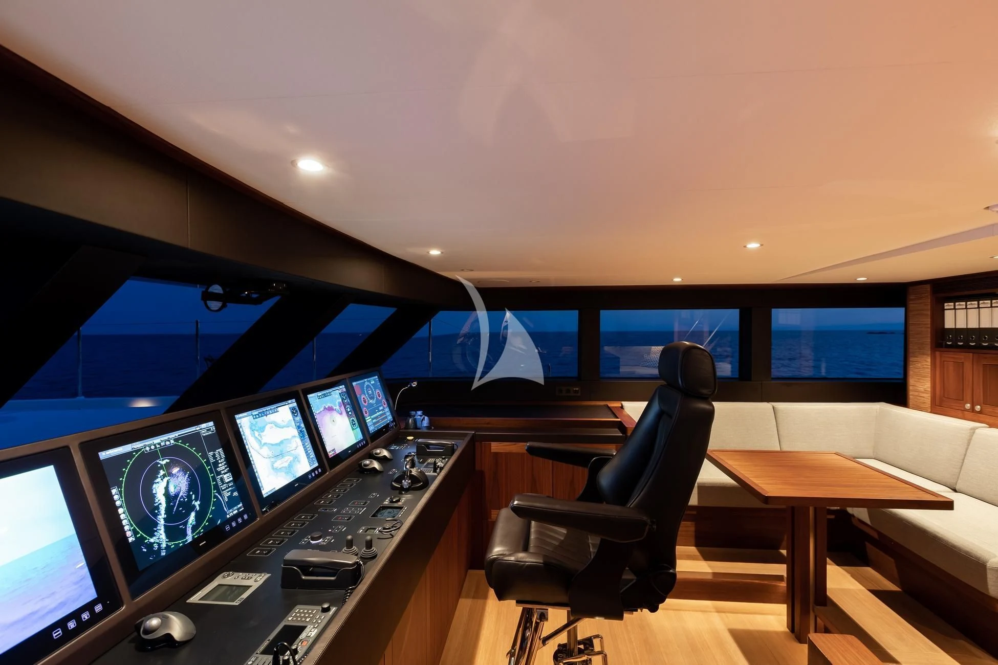 a room with many monitors and a table with chairs aboard JOSEPHINE I Yacht for Sale