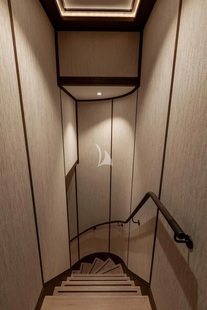 a wooden staircase with a glass door aboard JOSEPHINE I Yacht for Sale