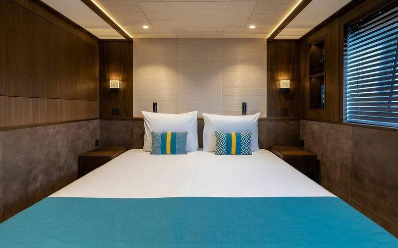 a hotel room with a large bed aboard JOSEPHINE I Yacht for Sale