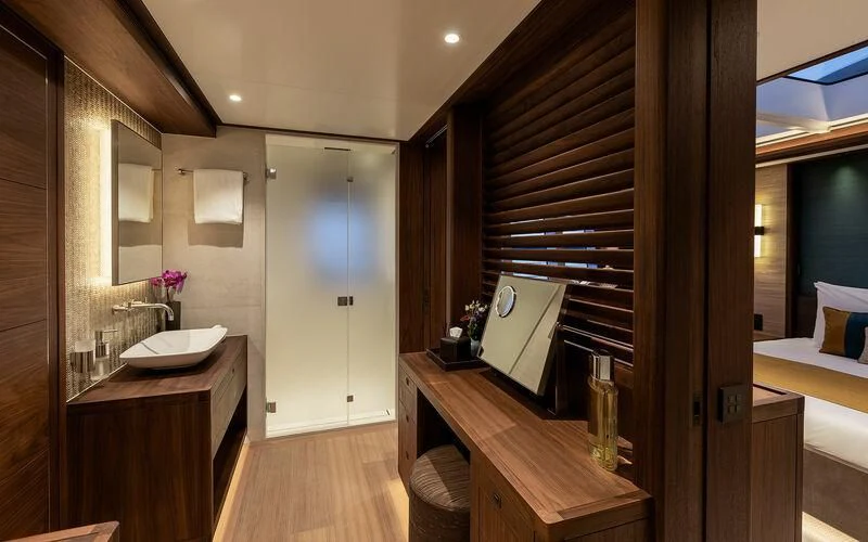 a bathroom with a sink and a mirror aboard JOSEPHINE I Yacht for Sale