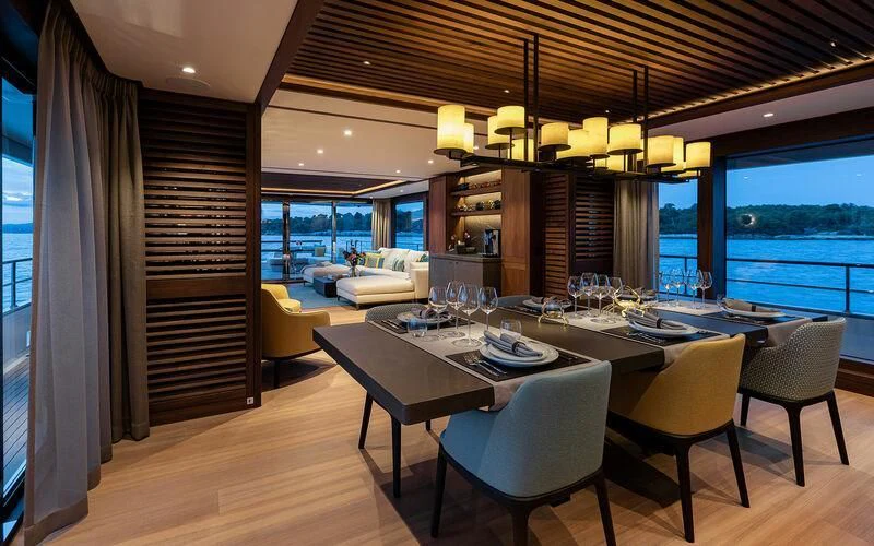 a large dining room with a view of the ocean aboard JOSEPHINE I Yacht for Sale