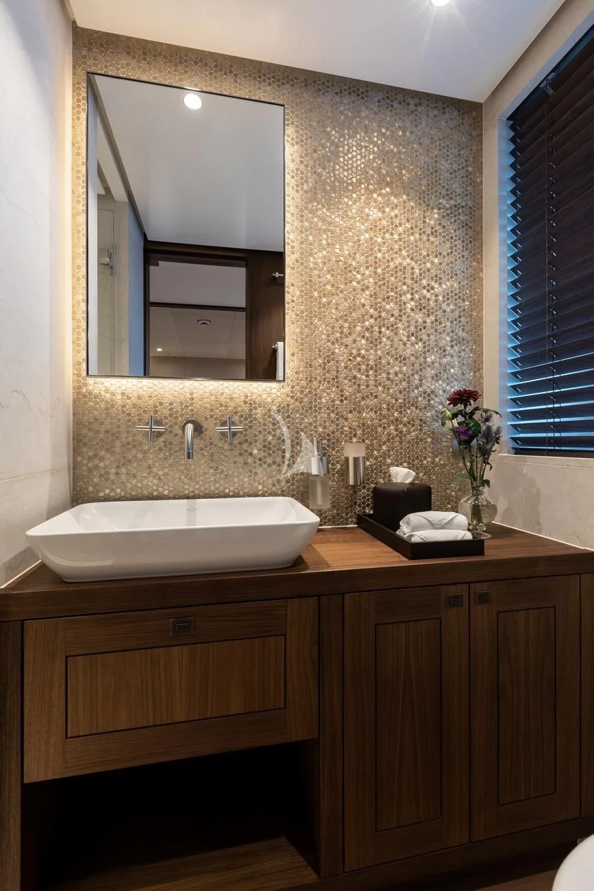 a bathroom with a sink and mirror aboard JOSEPHINE I Yacht for Sale
