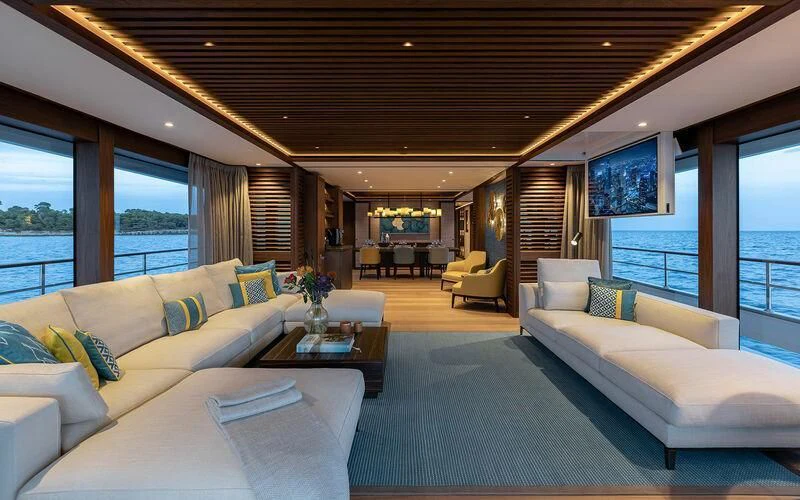 a living room with white couches aboard JOSEPHINE I Yacht for Sale