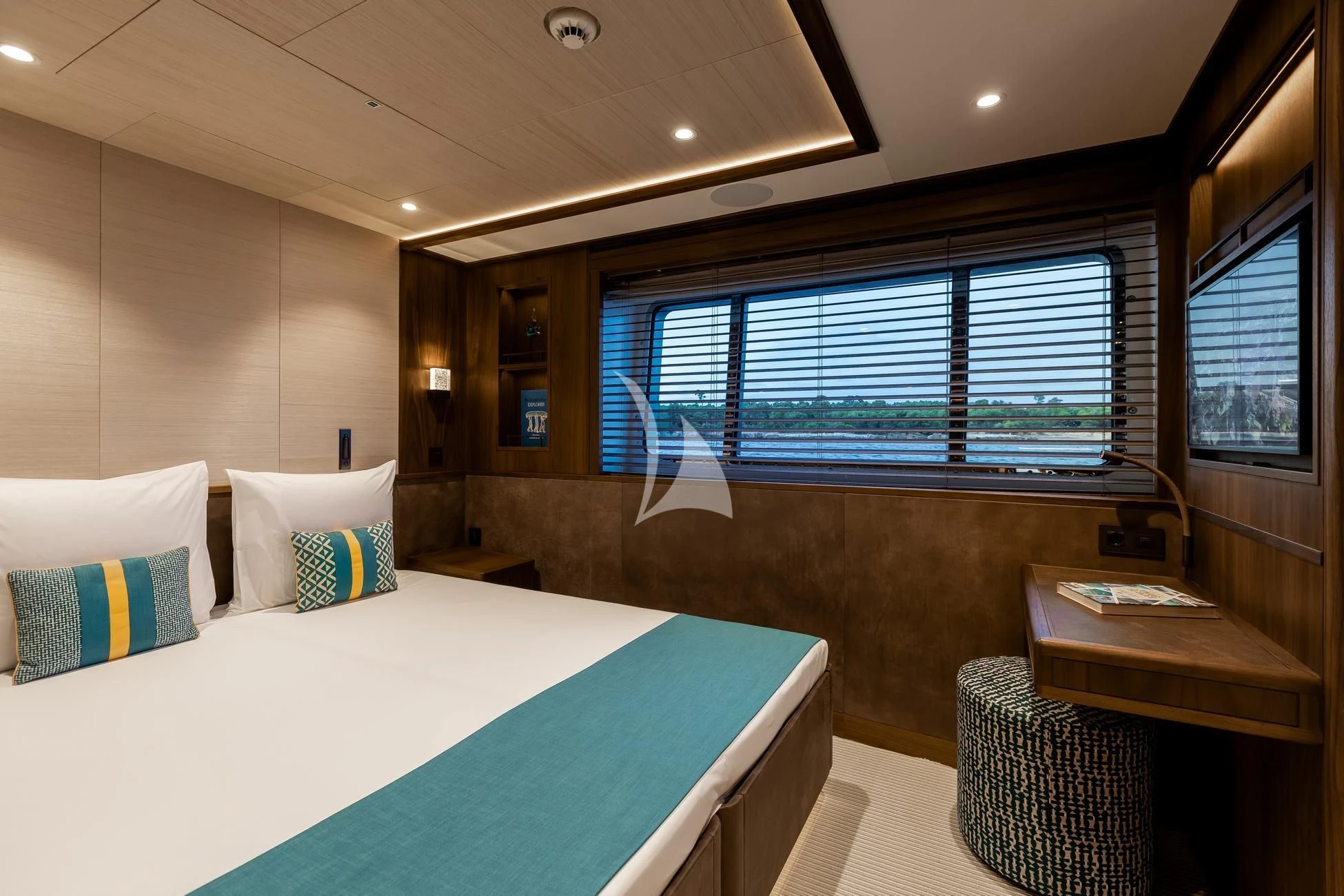 a hotel room with a bed and a window aboard JOSEPHINE I Yacht for Sale