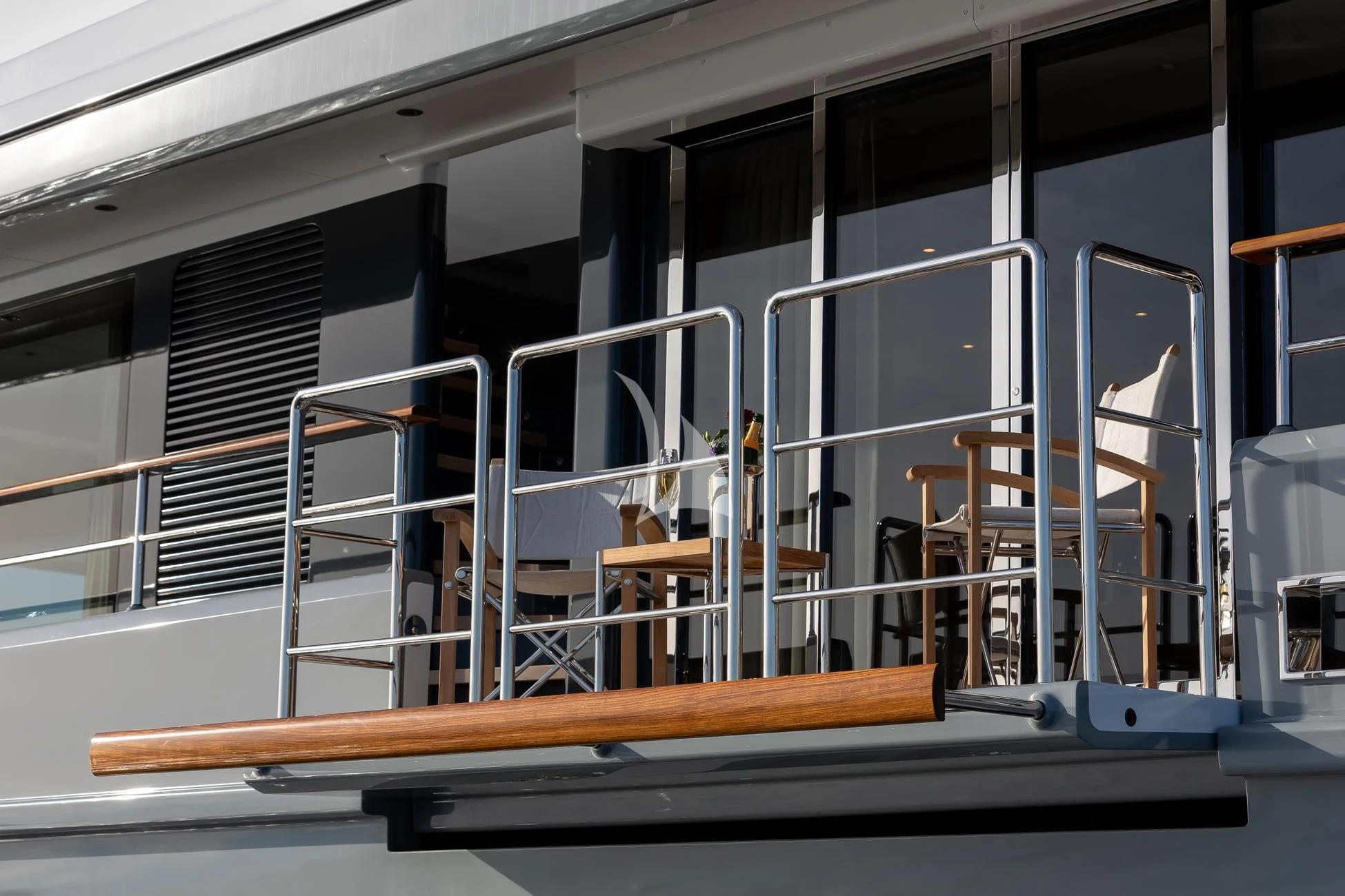 a room with a staircase and chairs aboard JOSEPHINE I Yacht for Sale