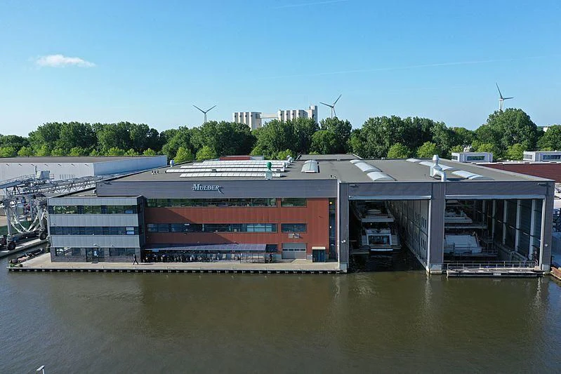 a building next to a body of water aboard JOSEPHINE I Yacht for Sale