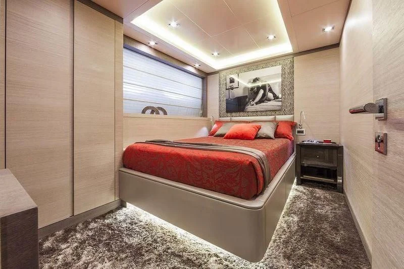 a bedroom with a bed and a desk aboard PANTHERA Yacht for Sale