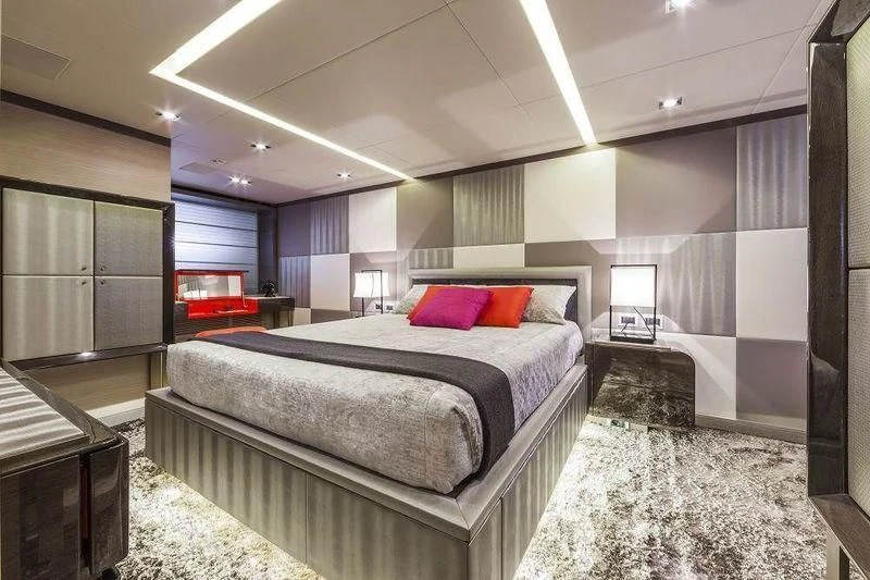 a bedroom with a bed and a desk aboard PANTHERA Yacht for Sale