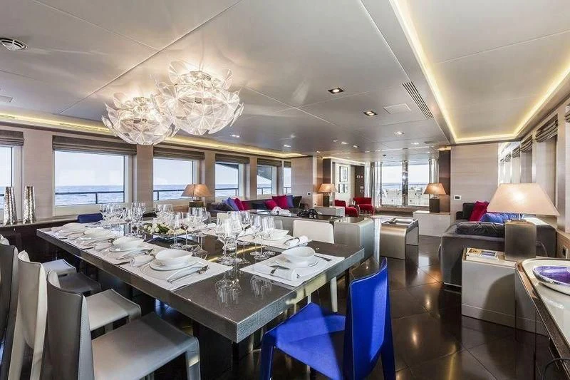 a large dining room with a chandelier aboard PANTHERA Yacht for Sale