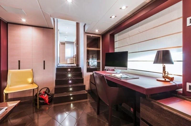 a room with a table and chairs aboard PANTHERA Yacht for Sale