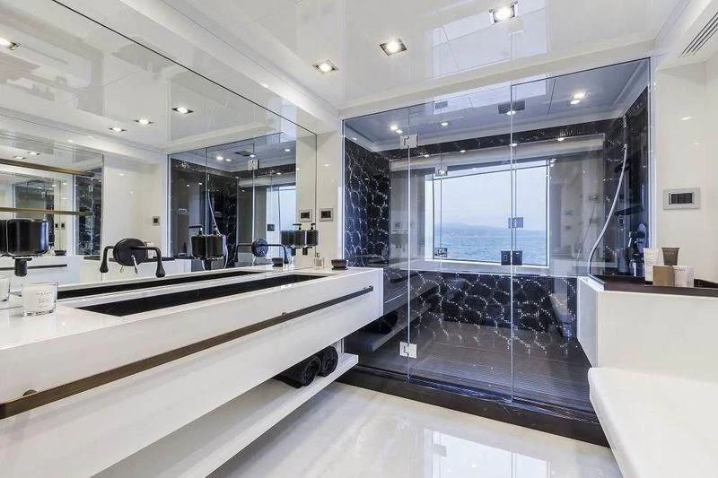 a large room with a large glass wall and a large mirror aboard PANTHERA Yacht for Sale