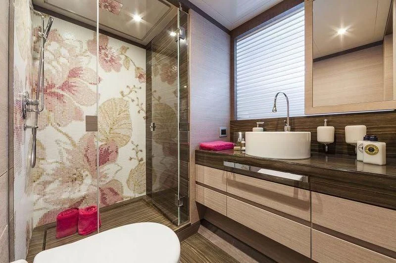 a bathroom with a glass shower aboard PANTHERA Yacht for Sale