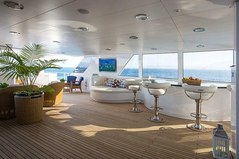 a room with a table and chairs aboard GRACE Yacht for Sale