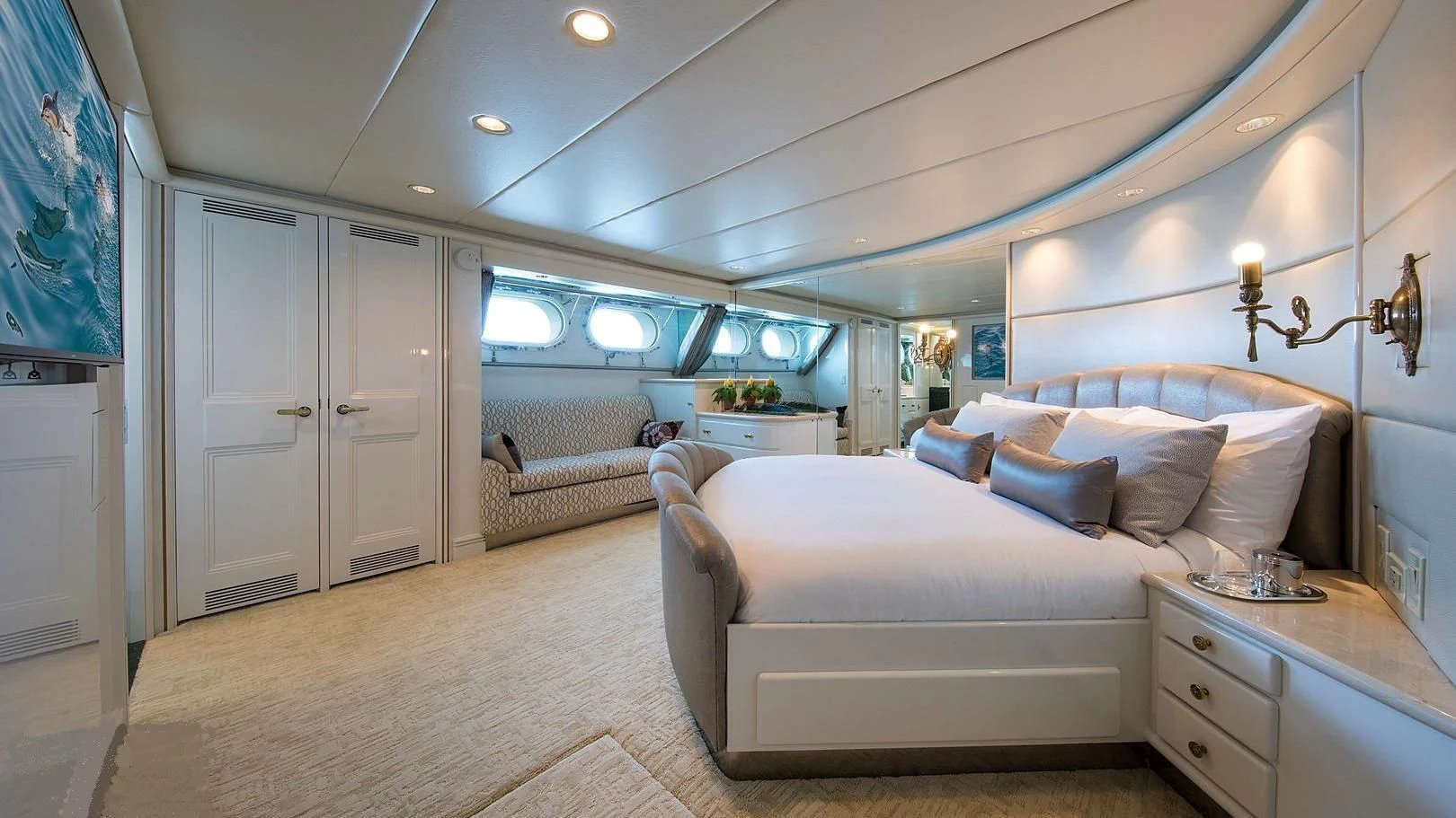 a large bedroom with a bed aboard GRACE Yacht for Sale